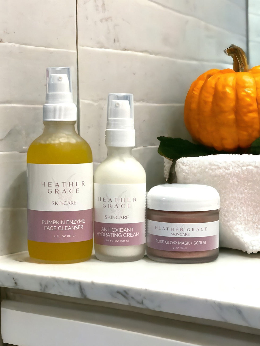 Pumpkin Enzyme Face Cleanser in a vibrant seasonal setting.
Antioxidant Hydrating Cream alongside fall decor.
Rose Glow Mask + Scrub ready for application.